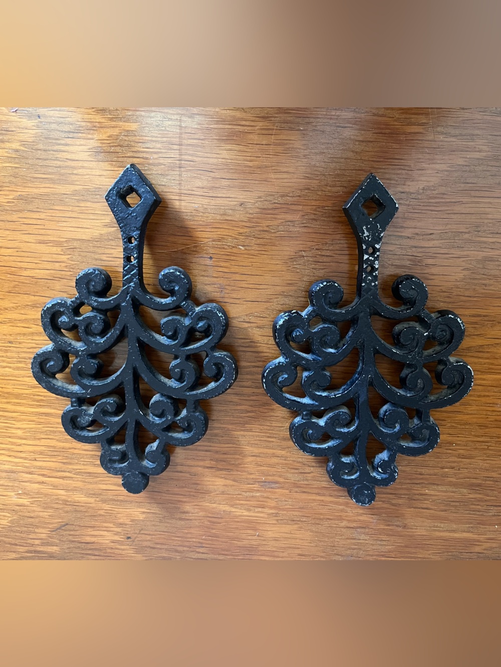 Two Cast Iron Trivet Wall Hangings